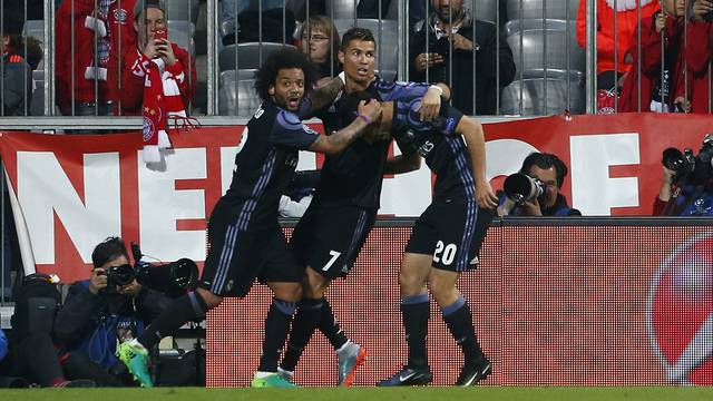 Real Madrid's Cristiano Ronaldo celebrates scoring their second goal with Marcelo and Marco Asensio