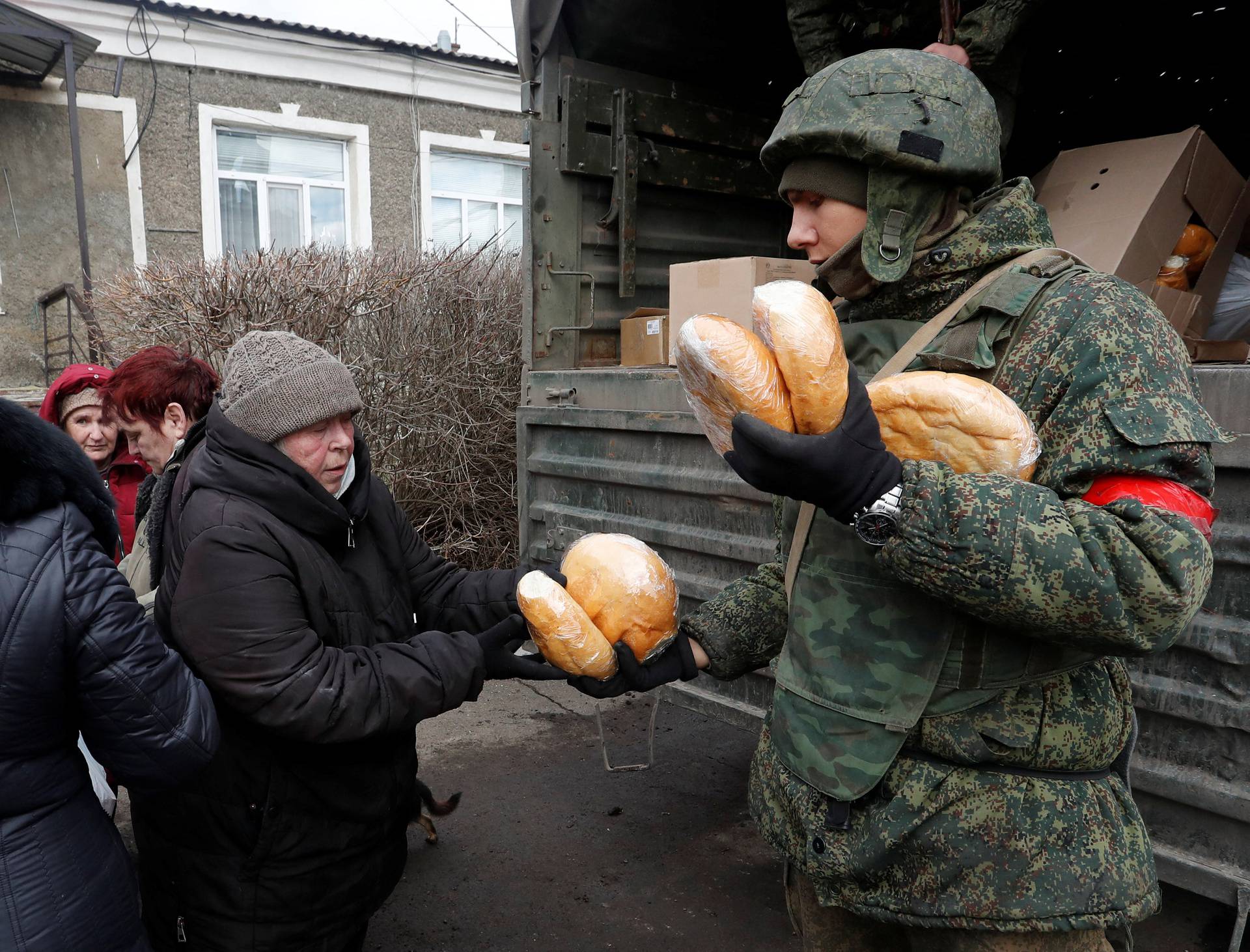 People receive humanitarian aid in the Donetsk region