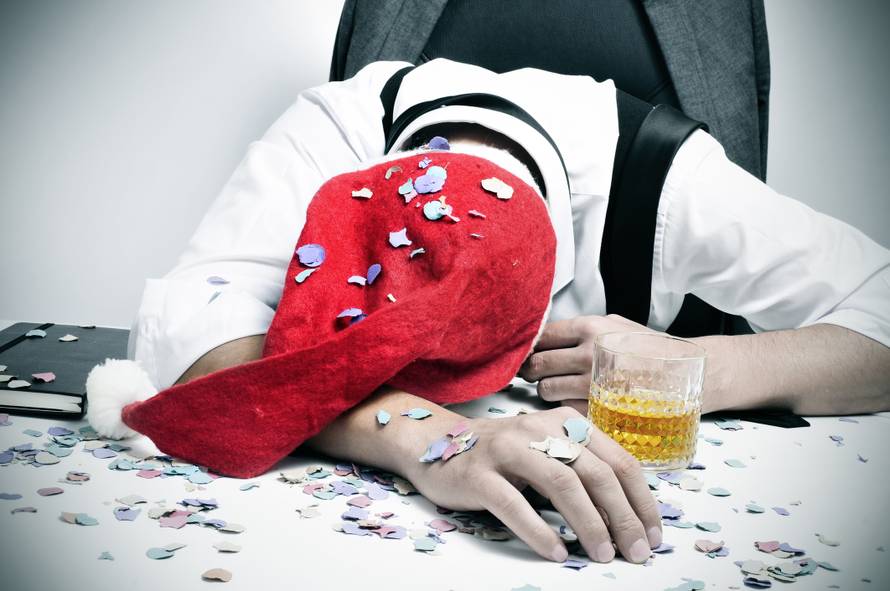 man sleeping in the office after a christmas party