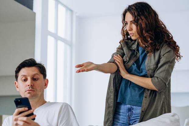 Irritated husband hides message in phone not wanting to show