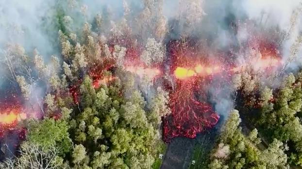 Lava emerges from the ground after Kilauea Volcano erupted, on Hawaii