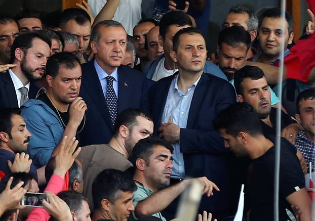Turkish President Erdogan is seen amid his supporters at the Ataturk Airport in Istanbul