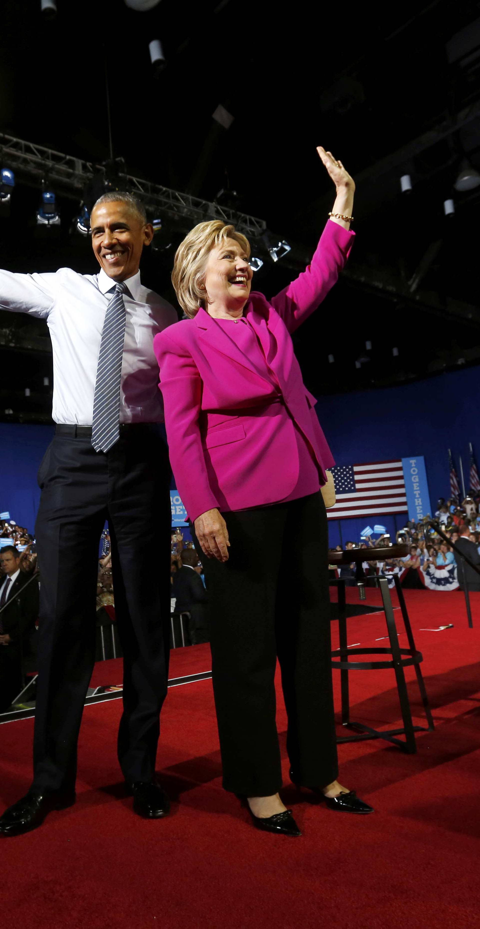 U.S. President Obama stands with Democratic U.S. presidential candidate Clinton at campaign event in Charlotte, North Carolina
