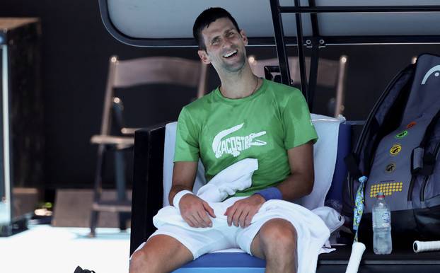 Serbian tennis player Novak Djokovic practices at Melbourne Park as questions remain over the legal battle regarding his visa to play in the Australian Open