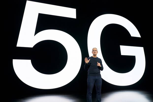 Apple CEO Tim Cook talking about the value of 5G for customers at an Apple event in Cupertino
