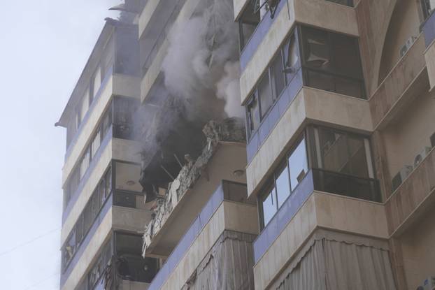 Smoke rises from a building following an Israeli air strike in Beirut