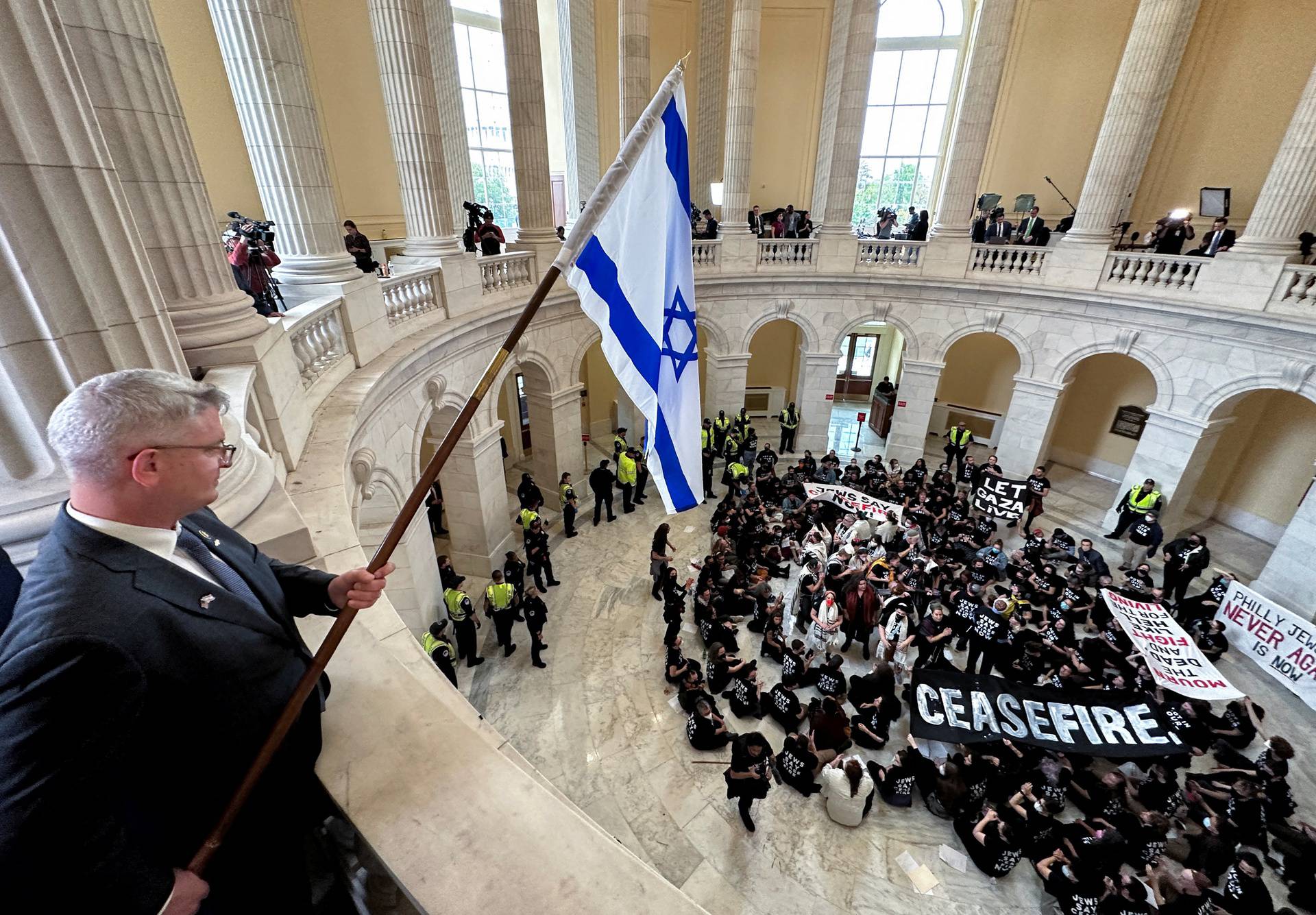 Protesters calling for a cease fire in Gaza occupy House office building rotunda on Capitol Hill in Washington