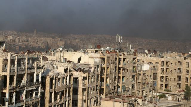 A general view shows rising smoke from burning tyres, which activists said are used to create smoke cover from warplanes, in Aleppo