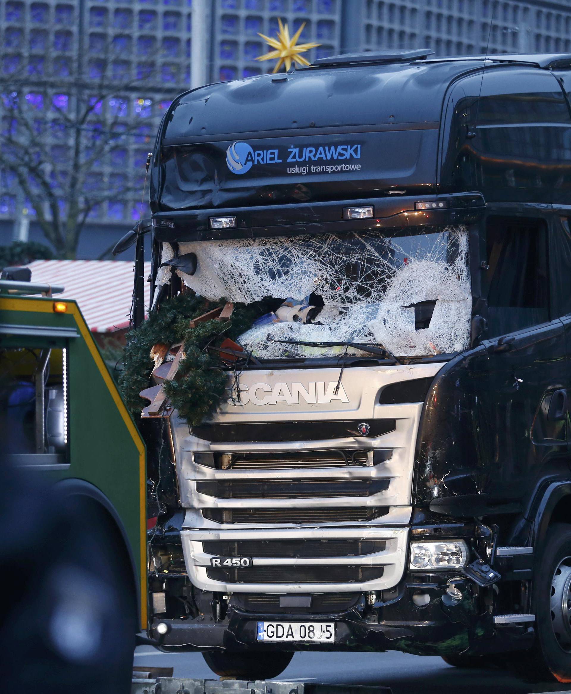 The crashed window of a truck is seen at a Berlin Christmas market