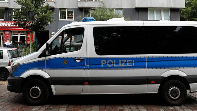 German police car is pictured during a raid in an apartment building at Kreuzberg district in Berlin
