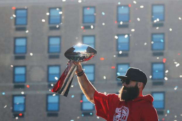 Super Bowl MVP New England Patriots wide receiver Julian Edelman carries a Lombardi trophy during a victory parade in Boston
