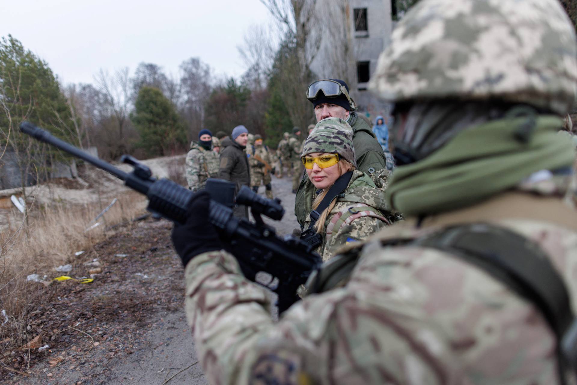 Alisa, a media relations specialist, takes part in a combat skills training conducted by the Territorial Defense Forces near Kyiv