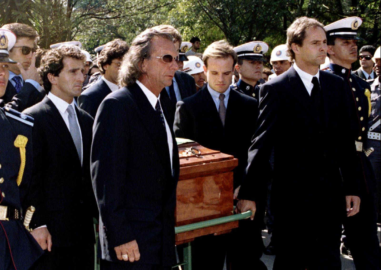 FILE PHOTO: Former Formula One racing champions carry Ayrton Senna's coffin to his grave during the funeral in Brazil