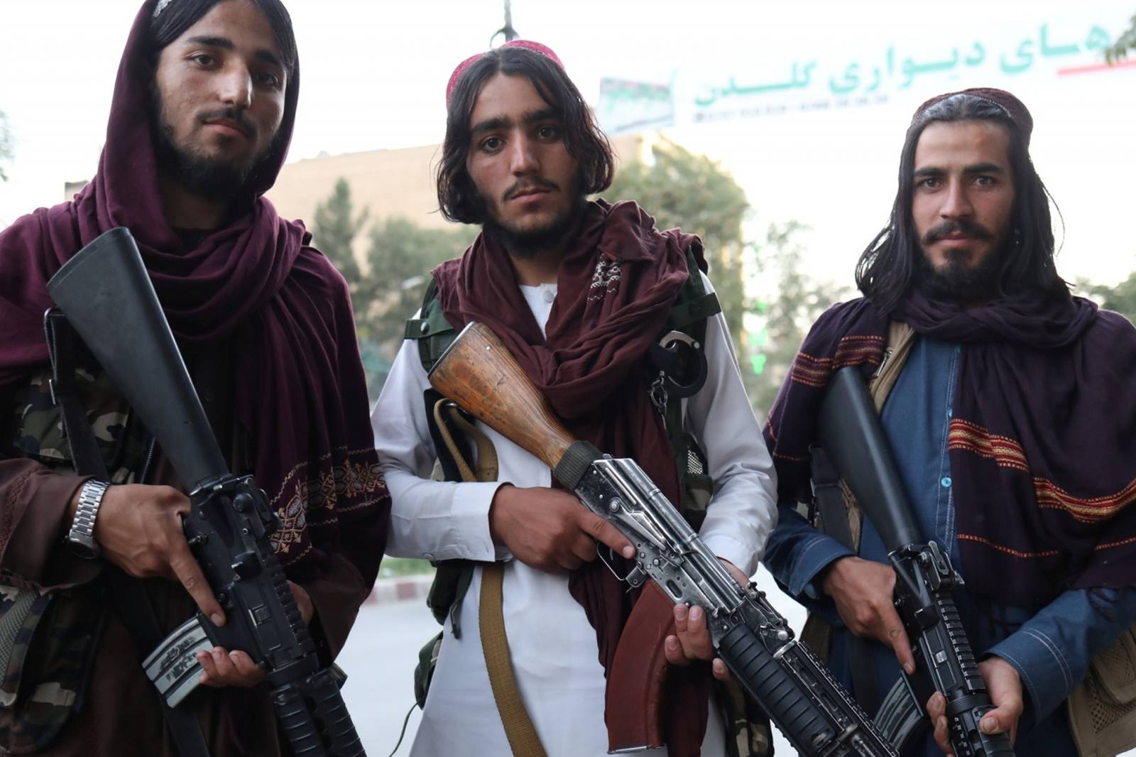 Taliban soldiers pose for a photo in Kabul