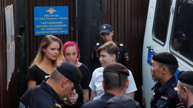 Intruders affiliated to anti-Kremlin punk band Pussy Riot, Nikulshina, Kurachyova and Pakhtusova, who ran onto the pitch during the World Cup final between France and Croatia, walk out of a detention center after leaving 15-day jail in Moscow