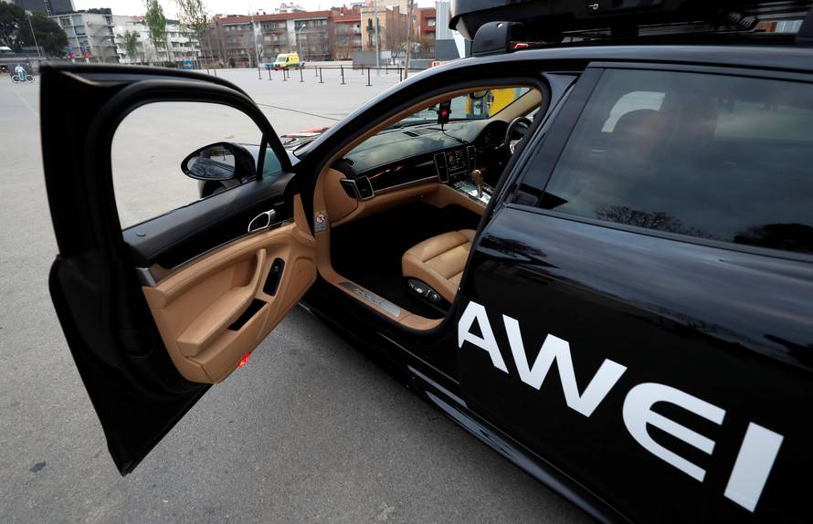 A driverless car controlled by a Huawei Mate 10 Pro mobile is pictured during the Mobile World Congress in Barcelona