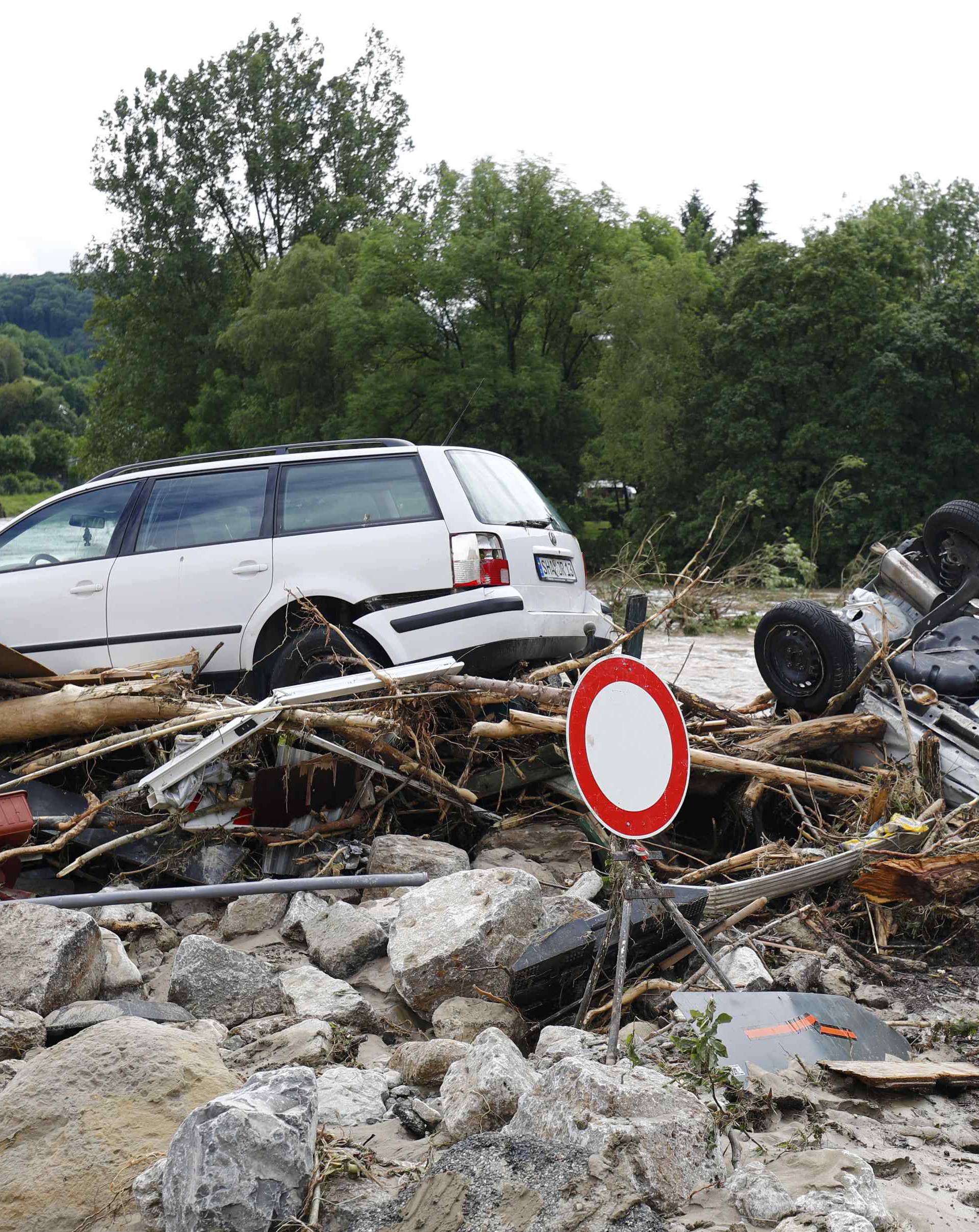 Cars lie amongst debris following floods in the town of Braunsbach in Baden-Wuerttemberg