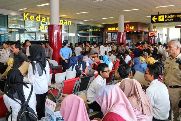 Relatives of passengers of the Lion Air plane that crashed into the sea are seen at Depati Amir airport in Pangkal Pinang, Belitung island