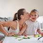 Mother,With,Child,Streaming,Online,Video,Of,Unboxing,Wooden,Toys.