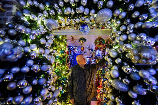 A family breaks their own world record for the most Christmas trees in their home