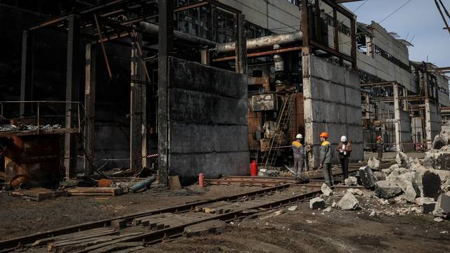 FILE PHOTO: People work at a thermal power plant damaged by recent Russian missile strike