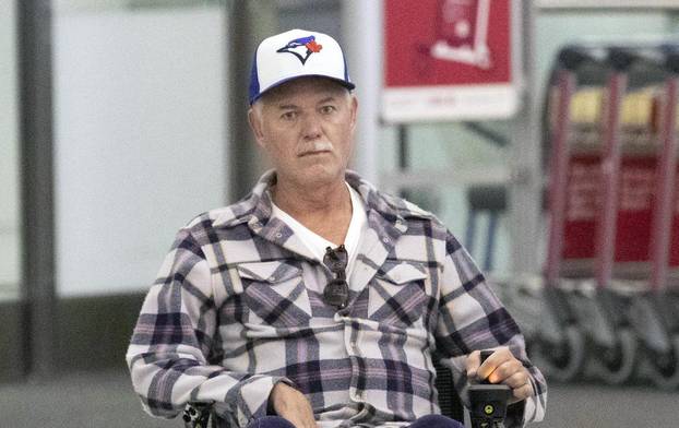 EXCLUSIVE: Eric Dane is Spotted in a Wheelchair as He Leaves Toronto International Airport.