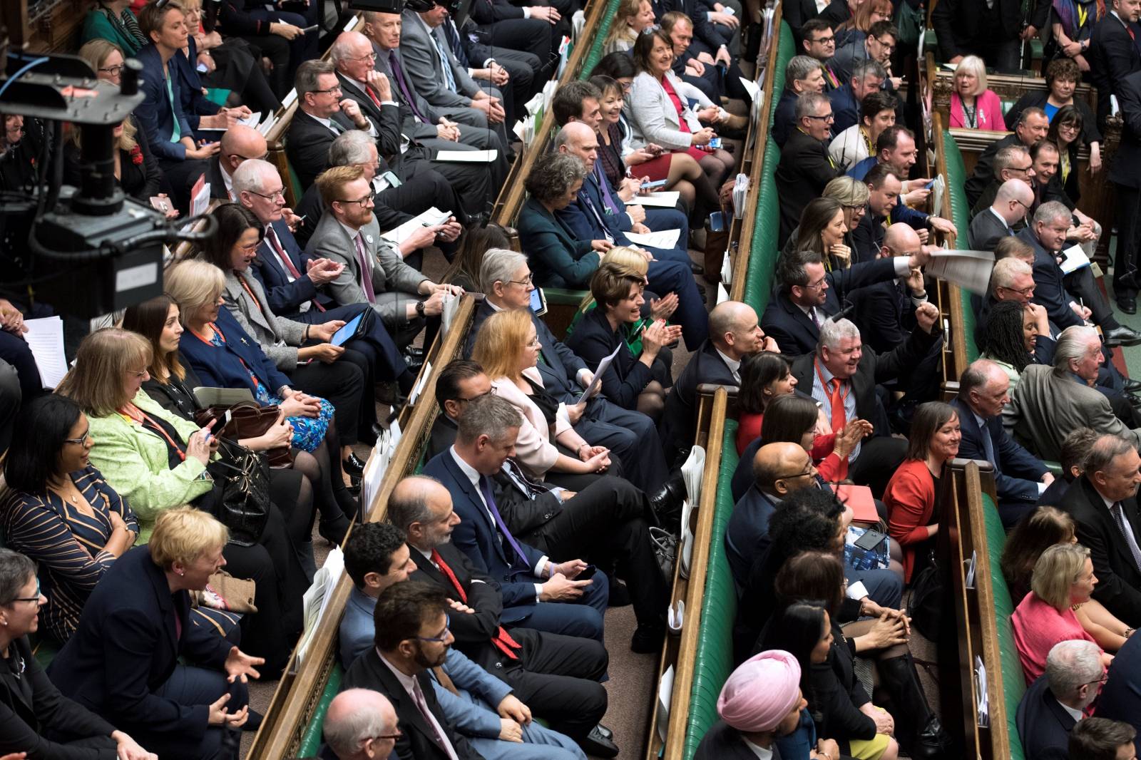 MPs react in Parliament following the vote on Brexit in London