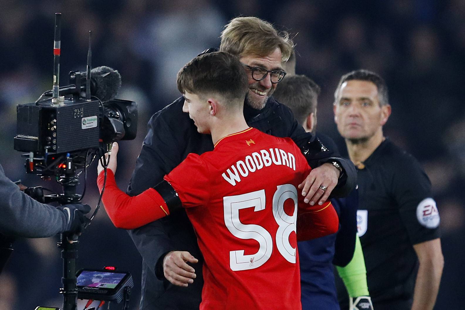 Liverpool's Ben Woodburn and manager Juergen Klopp celebrate after the game