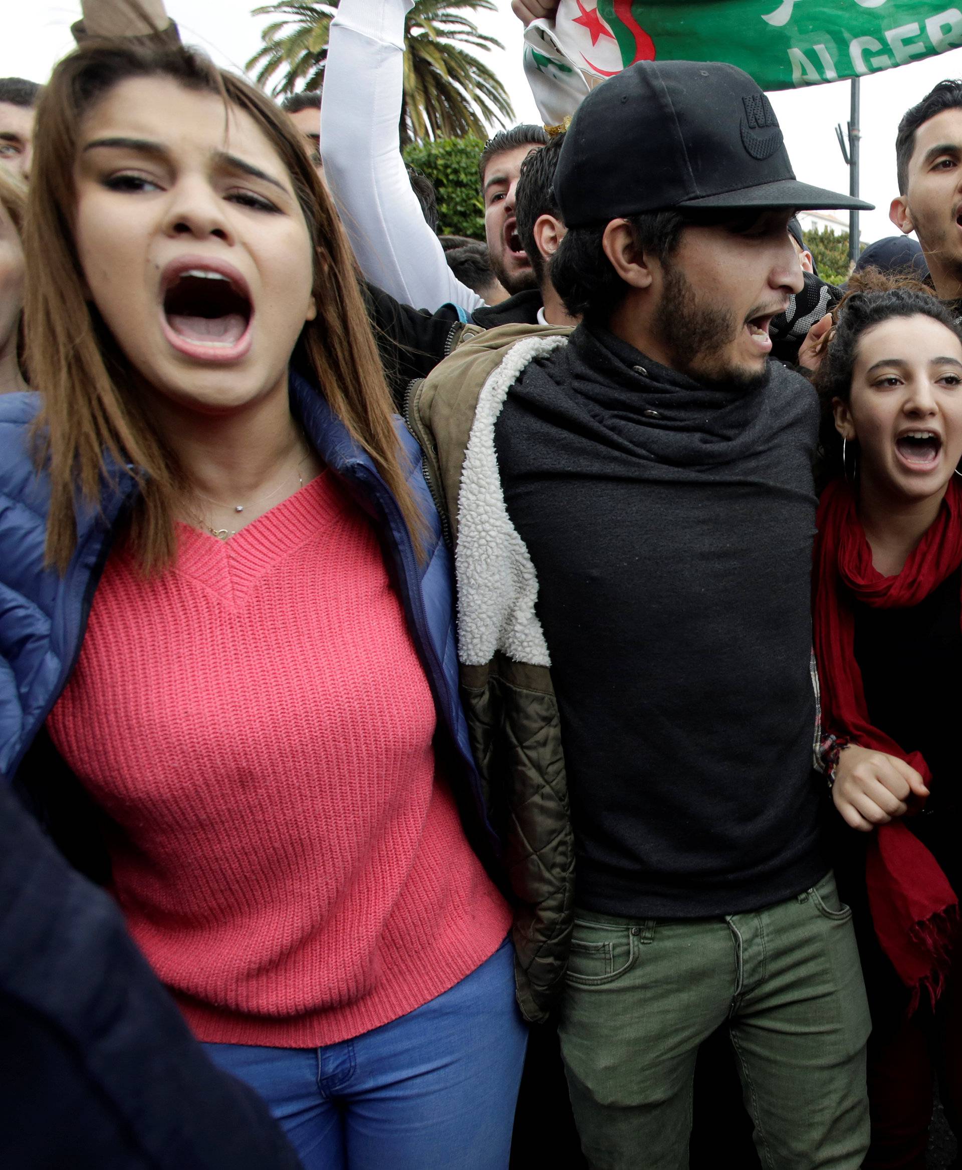 Police stand guard as students protest against President Abdelaziz Bouteflika's plan to extend his 20-year rule by seeking a fifth term in Algiers