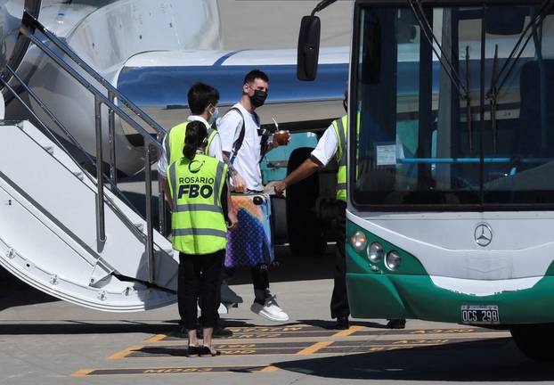 Argentine footballer Lionel Messi gets down from a plane on arrival at the Islas Malvinas airport, in Rosario