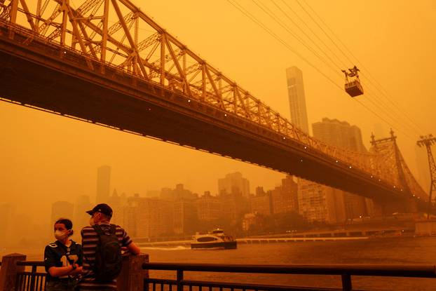 Haze and smoke shroud Manhattan skyline from Canadian wildfires in New York