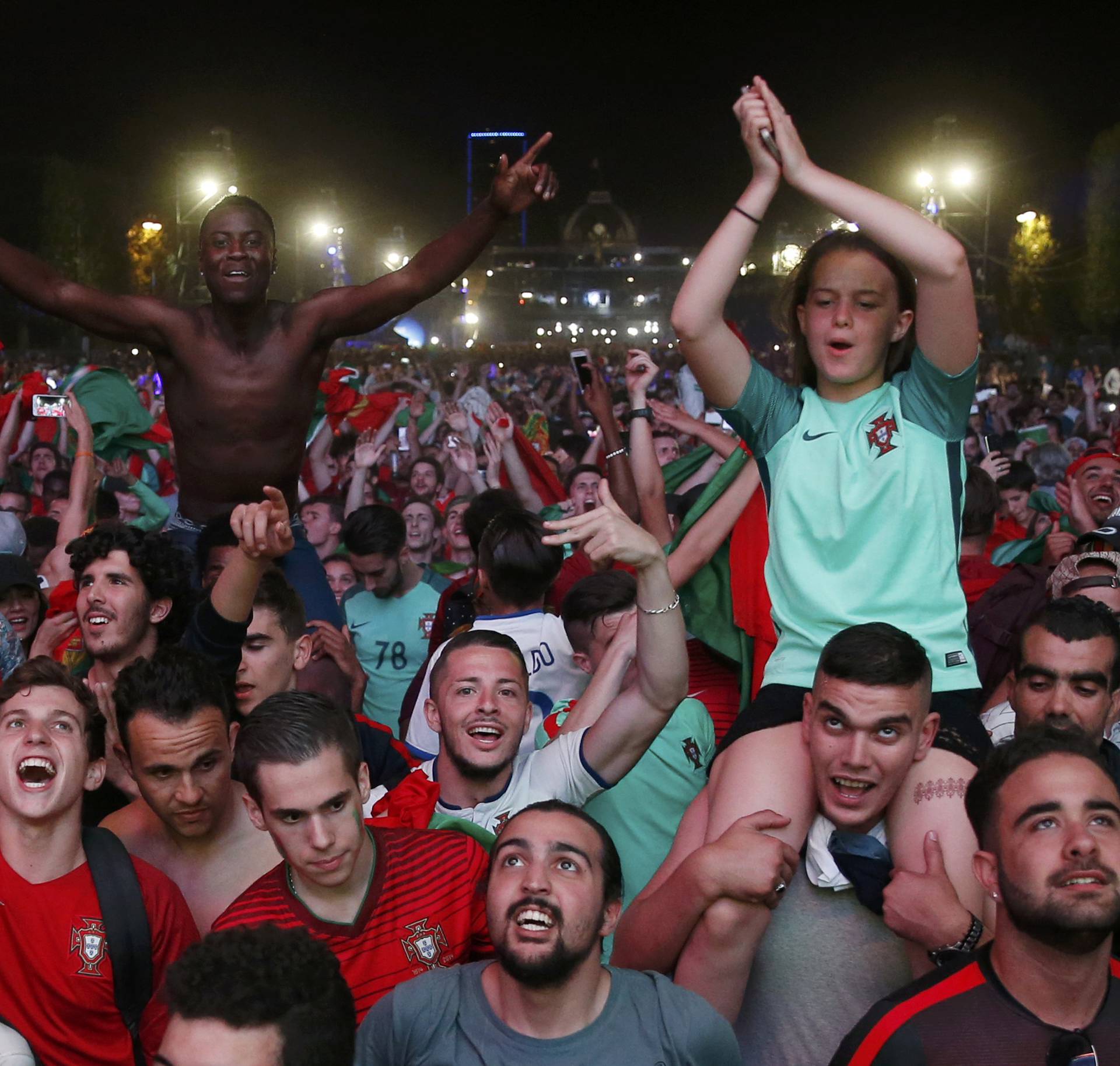 Portugal fans react at Paris fan zone during a EURO 2016 final soccer match       