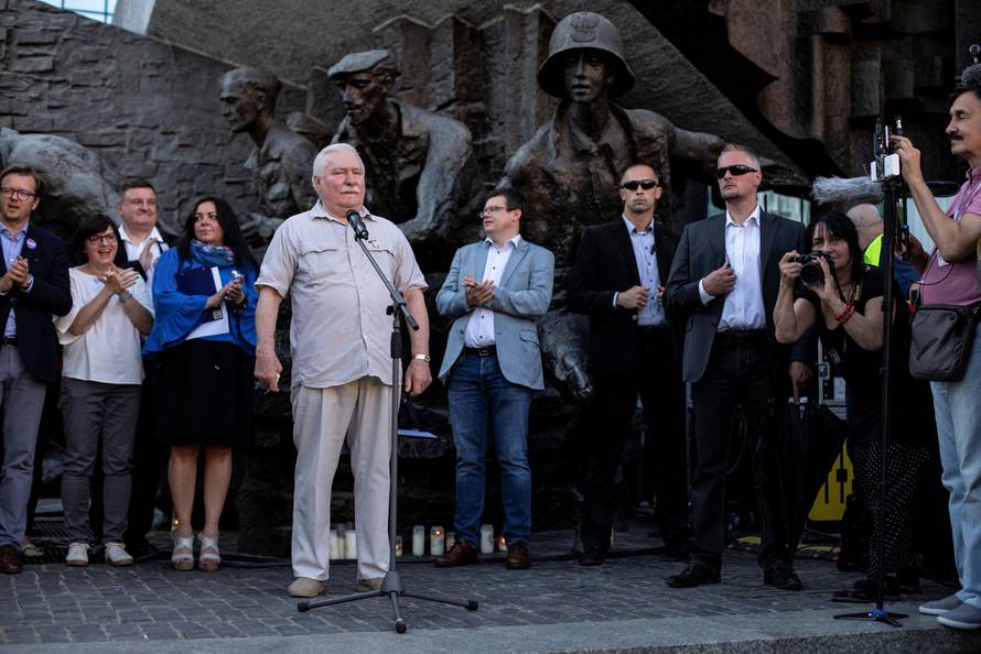 Former Polish President Lech Walesa speaks during a protest against the conservative government's makeover of the Polish judiciary in Warsaw