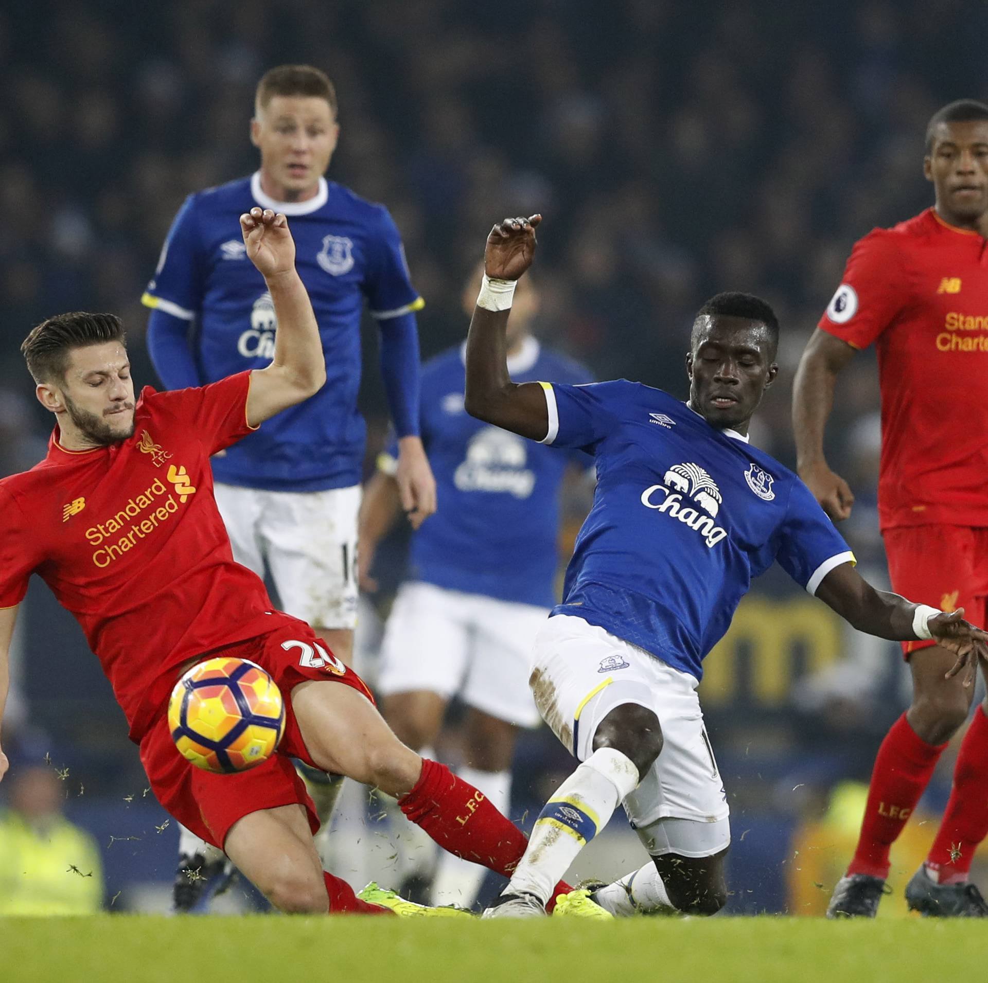 Liverpool's Adam Lallana in action with Everton's Enner Valencia