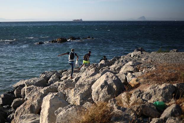 Mass crossings of migrants on foot and by sea from Morocco into Spanish territory, in Ceuta