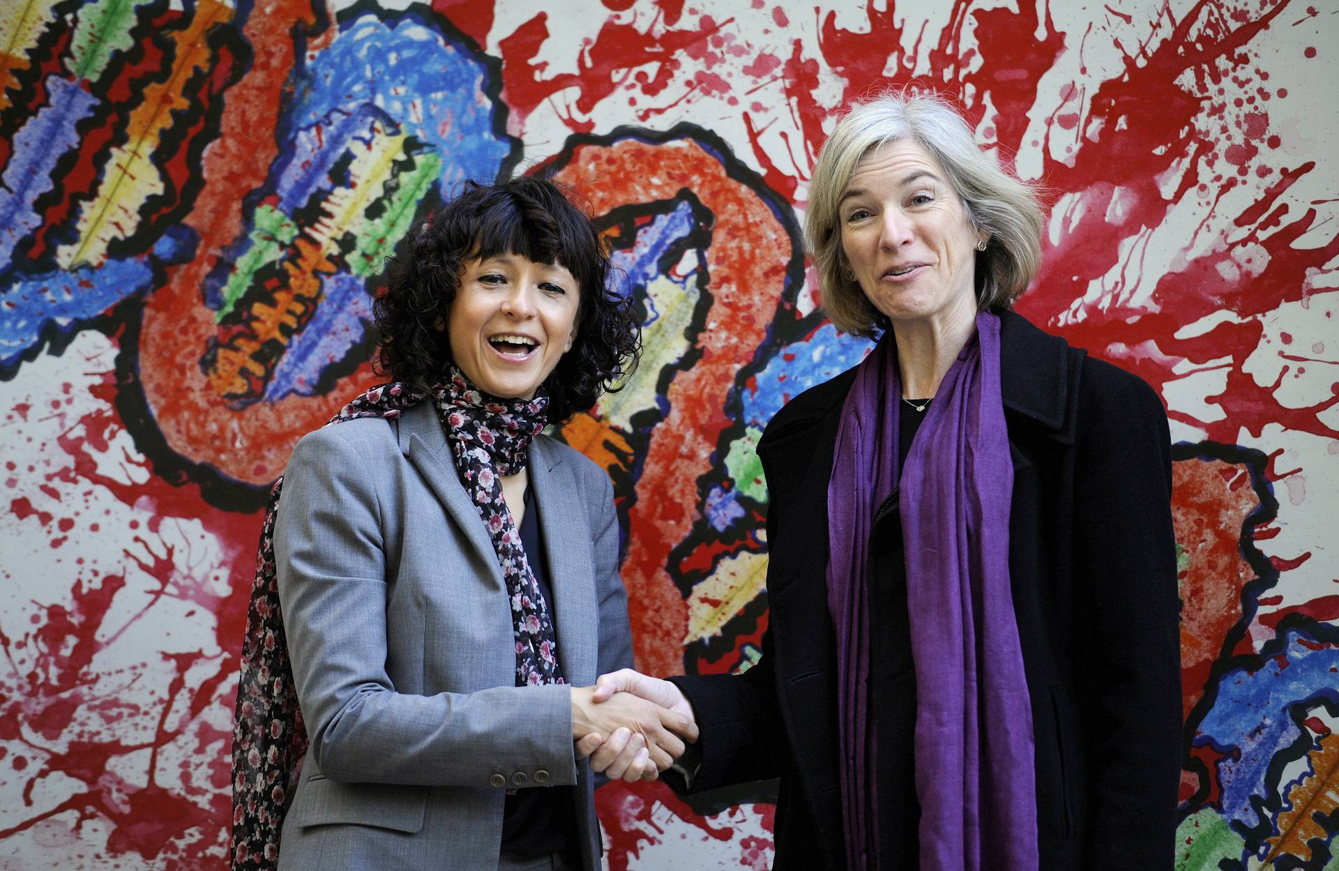 FILE PHOTO: French microbiologist Emmanuelle Charpentier (L) and professor Jennifer Doudna of the U.S. pose for the media during a visit to a painting exhibition by children about the genome, at the San Francisco park in Oviedo