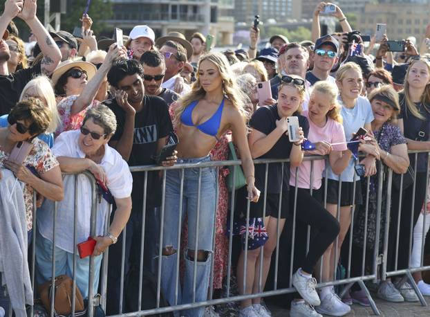 EXCLUSIVE: *NO DAILYMAIL ONLINE* King Charles's Only Fan! A 22-Year Old Royal-Blue Bikini Clad OnlyFans Royal-Fan Flashes A Suggestive Sign At King Charles During His Sydney Opera House Visit - 22 Oct 2024