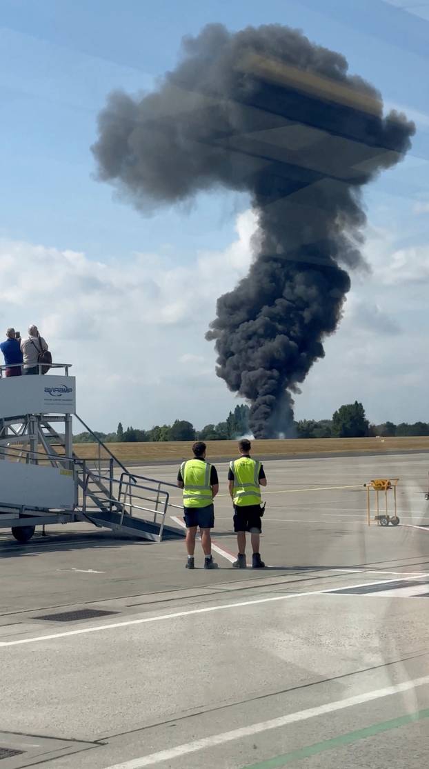 A plume of black smoke rises near Southend runway following small plane crash