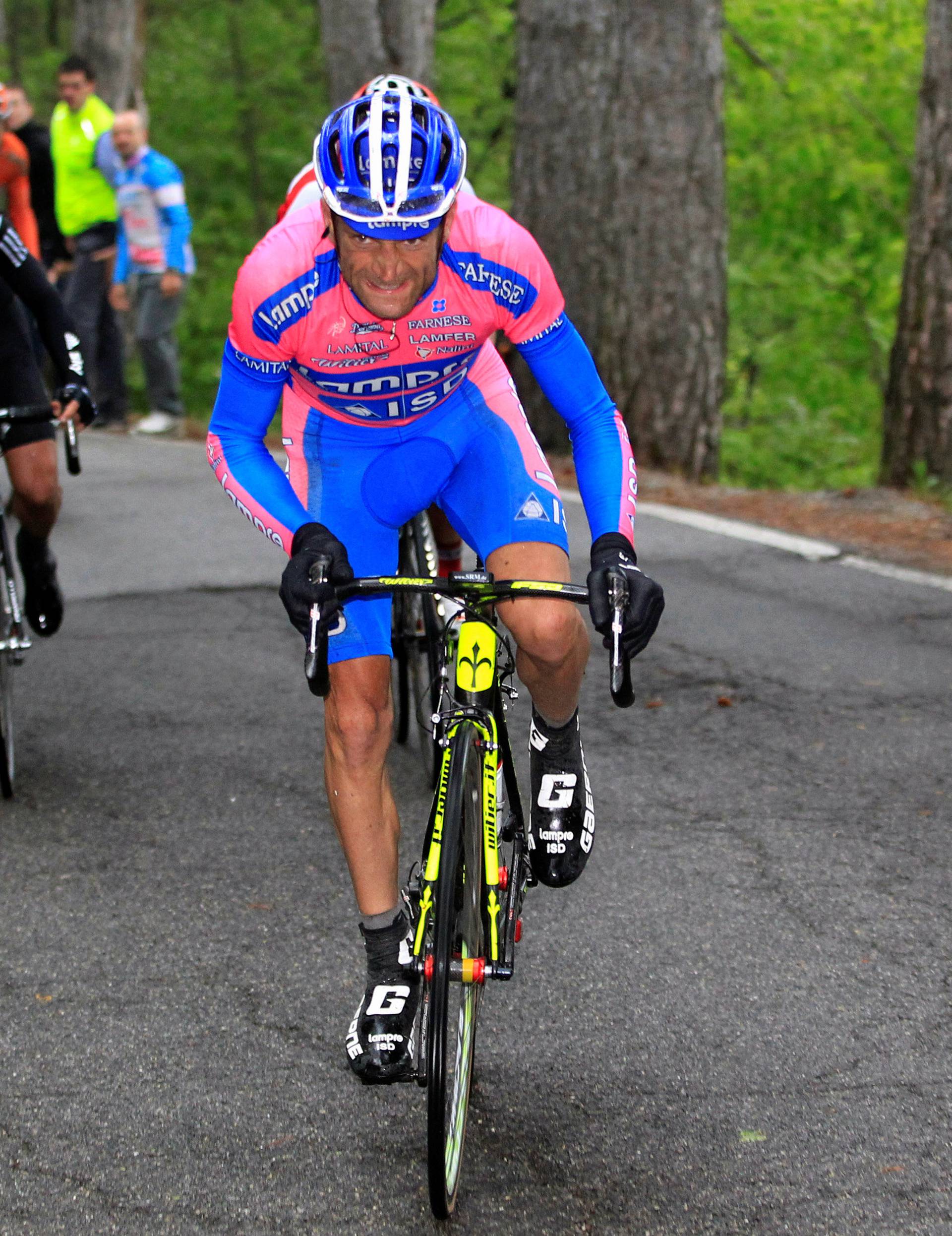 FILE PHOTO: Lampre-ISD's Scarponi of Italy climbs during the 169 km 15th stage  of the Giro d'Italia from Busto Arsizio to Pian de Resinelli