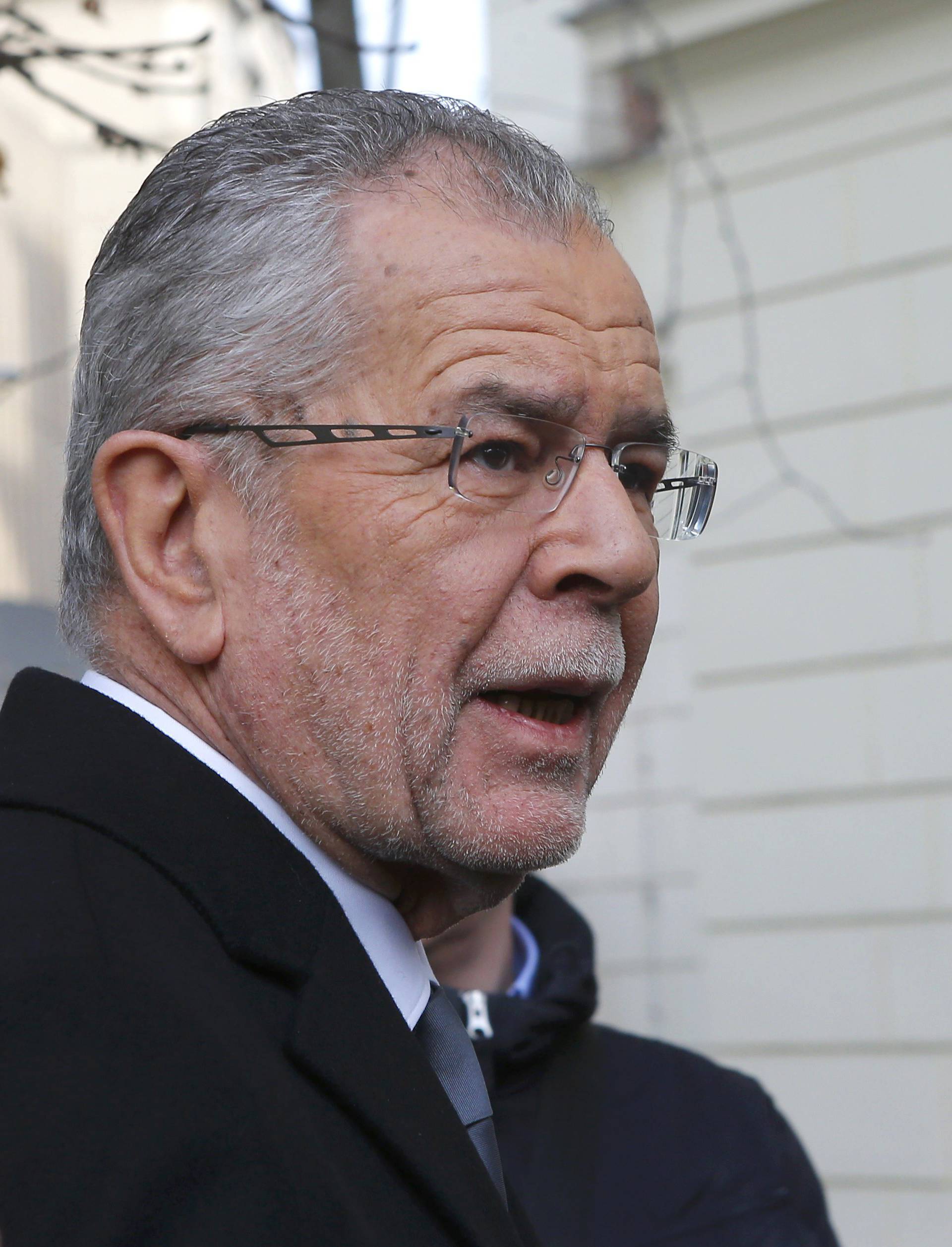 Austrian presidential candidate Van der Bellen, who is supported by the Greens, arrives in front of a polling station to cast his vote in Vienna