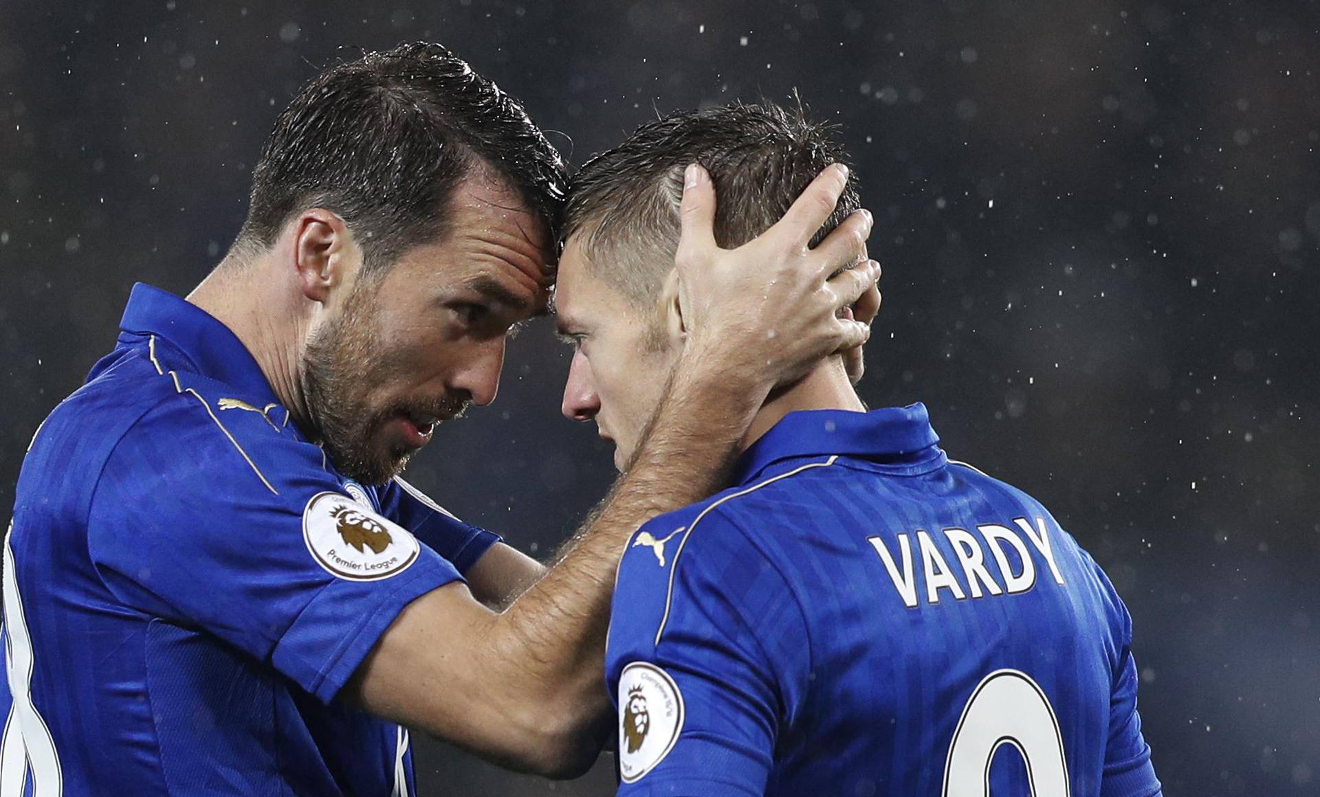 Leicester City's Jamie Vardy celebrates scoring their first goal with Christian Fuchs