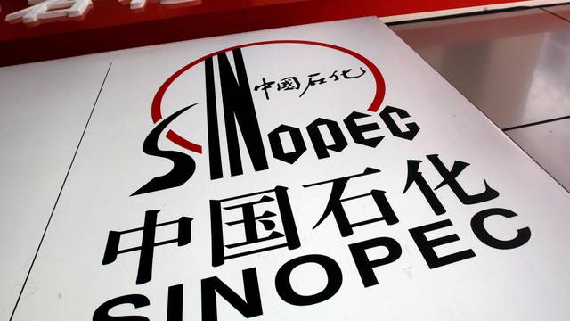 FILE PHOTO: Company logo of Sinopec Corp is displayed at gas station in Hong Kong