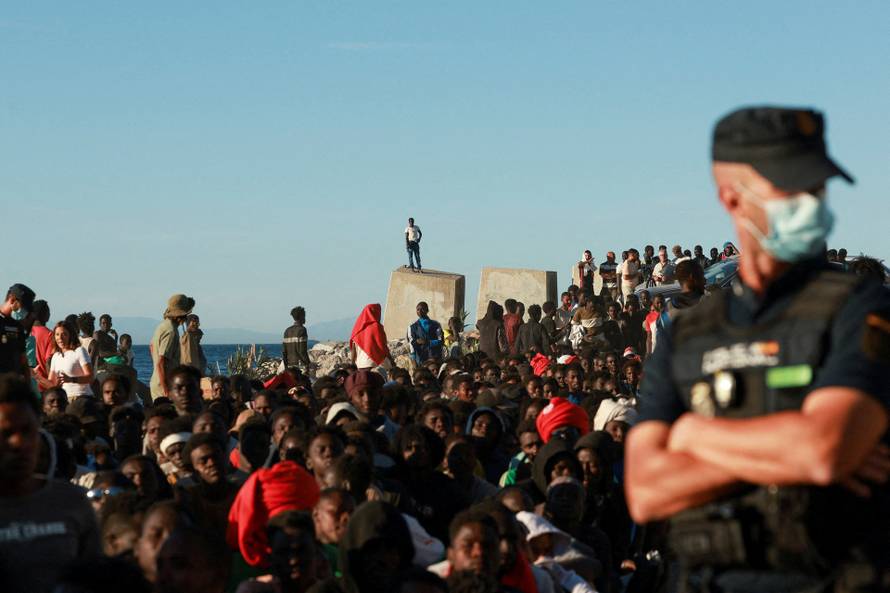 Mass crossings of migrants on foot and by sea from Morocco into Spanish territory, in Ceuta