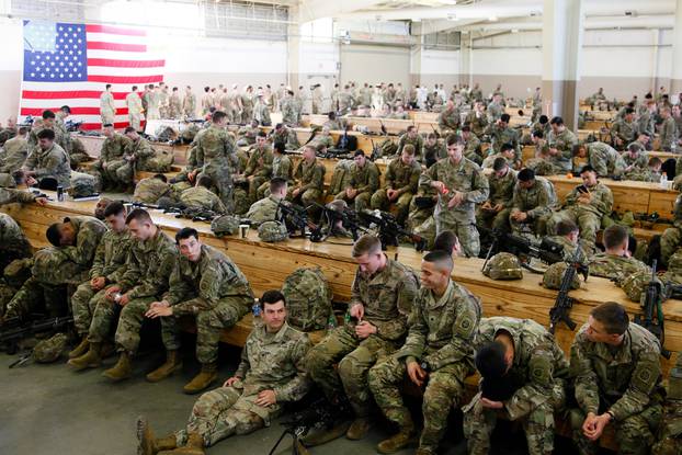 U.S. Army paratroopers assigned to 1st Brigade Combat Team, 82nd Airborne Division board an aircraft bound for the U.S. Central Command area of operations from Fort Bragg