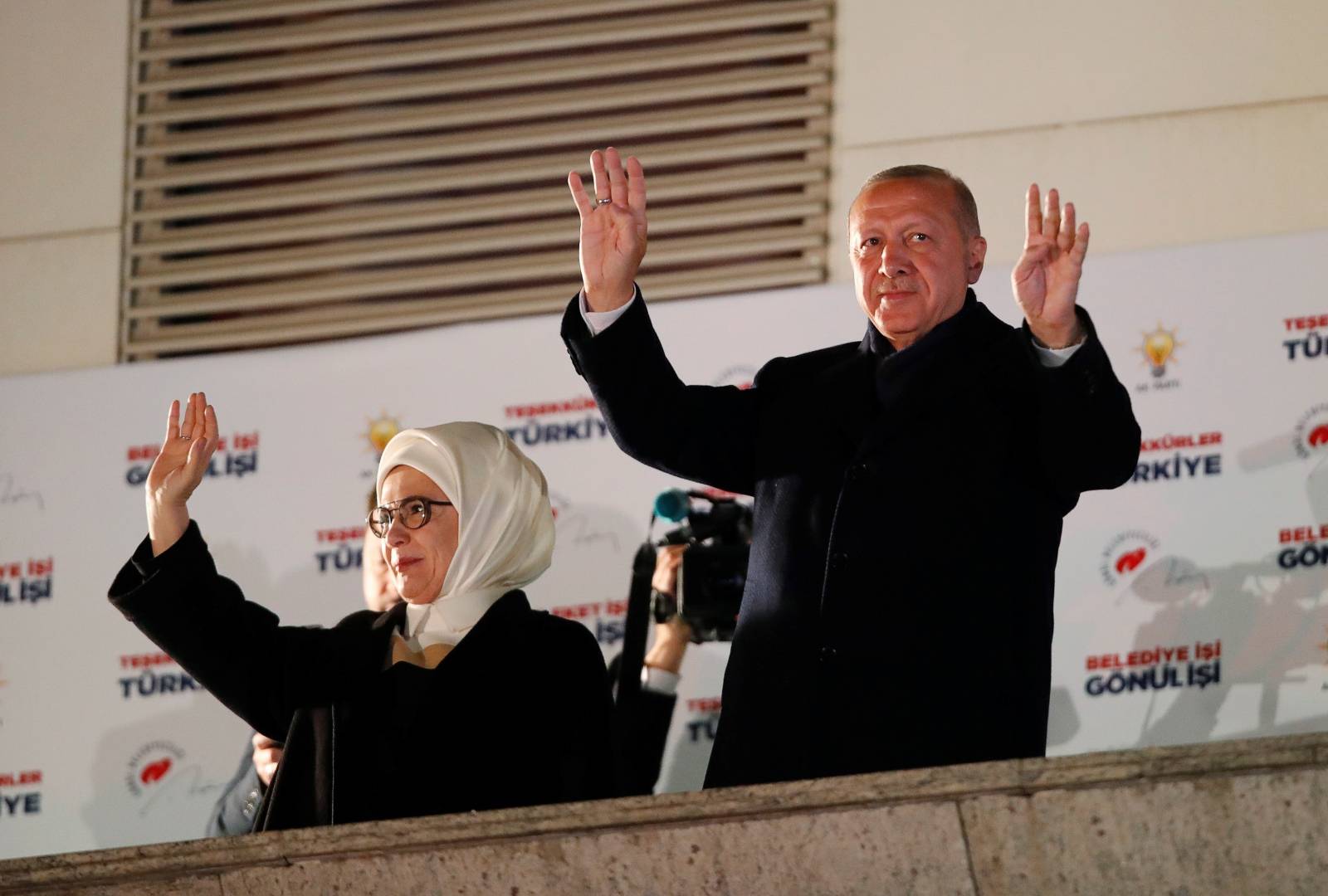 Turkish President Tayyip Erdogan and his wife Emine greet supporters in Ankara