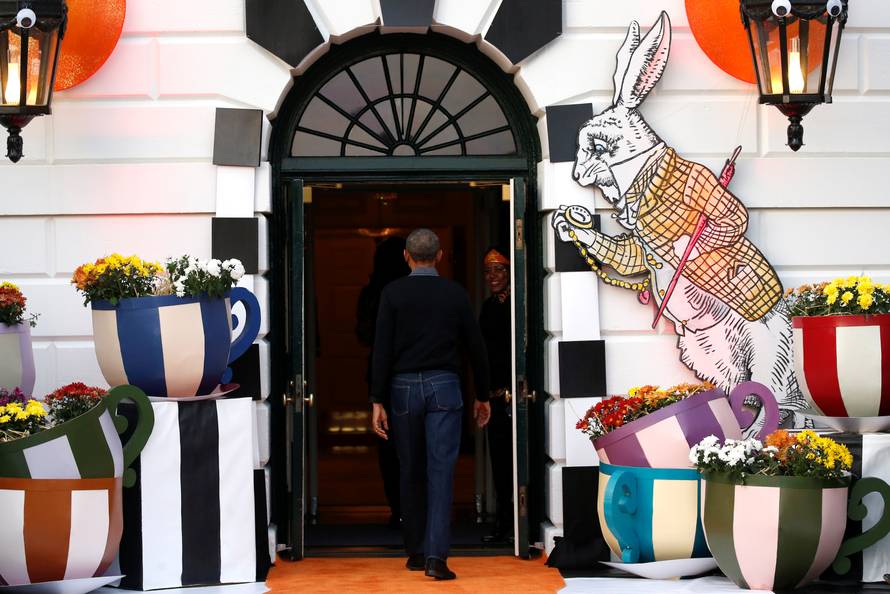 Obama departs after giving out Halloween treats to children from the South Portico of the White House in Washington