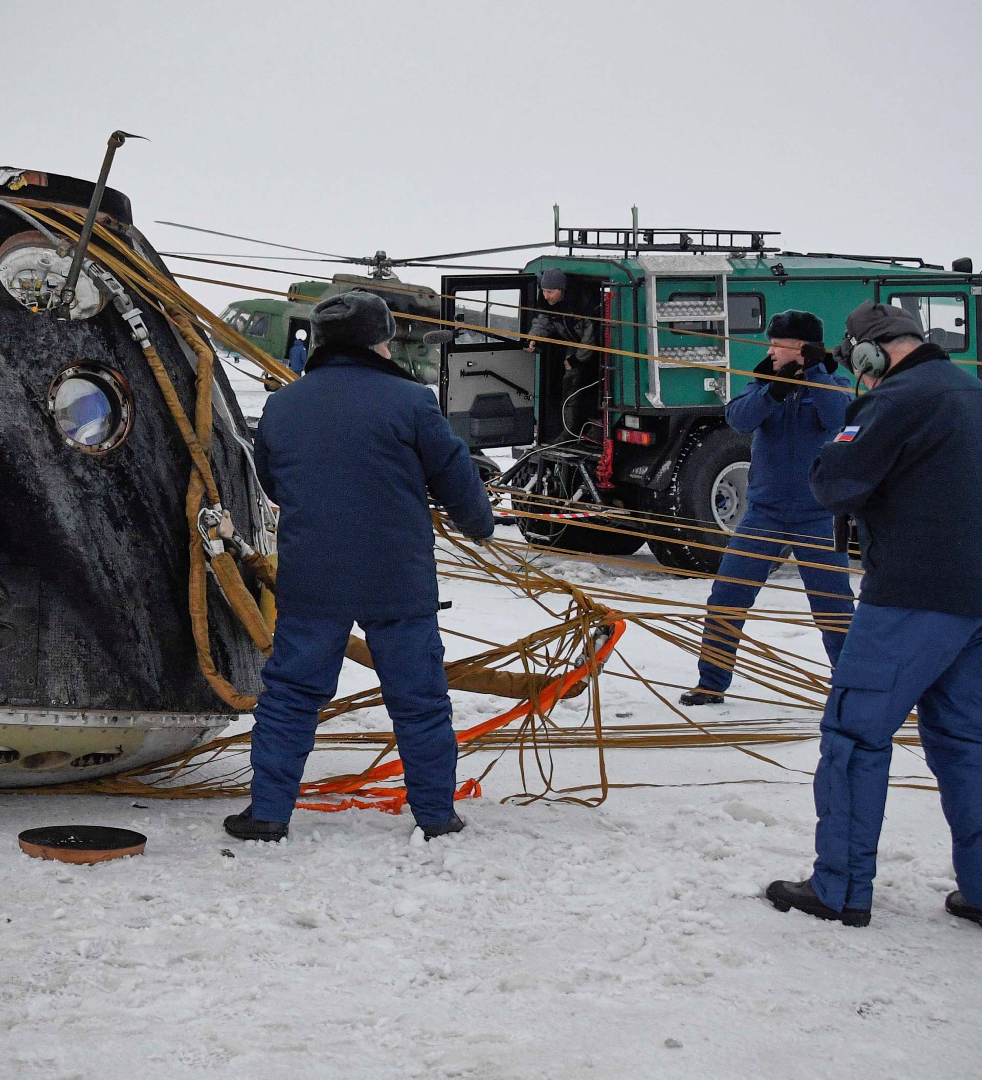 Search and rescue teams work at the site of the landing of the Soyuz MS-06 space capsule with International Space Station crew members in a remote area outside the town of Dzhezkazgan (Zhezkazgan), Kazakhstan