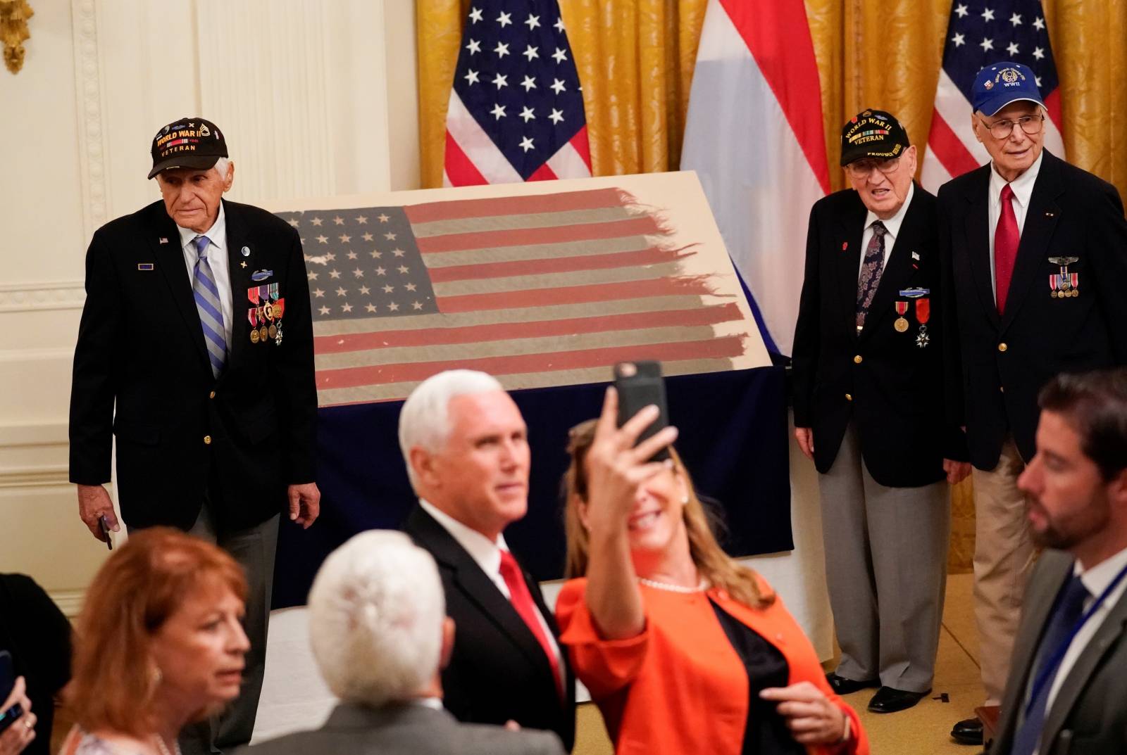 Trump and Netherlands Prime Minister Rutte take part in a flag presentation at the White House in Washington