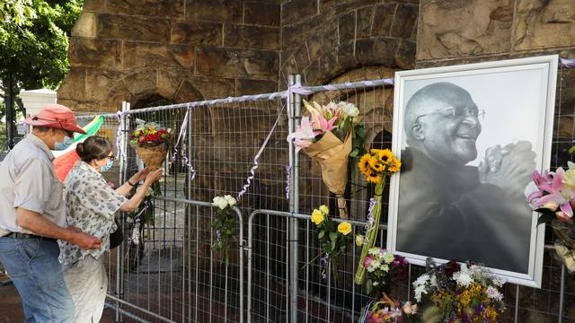 Mourners pay their respects to the late Archishop Desmond Tutu outside St Georges cathedral in Cape Town,