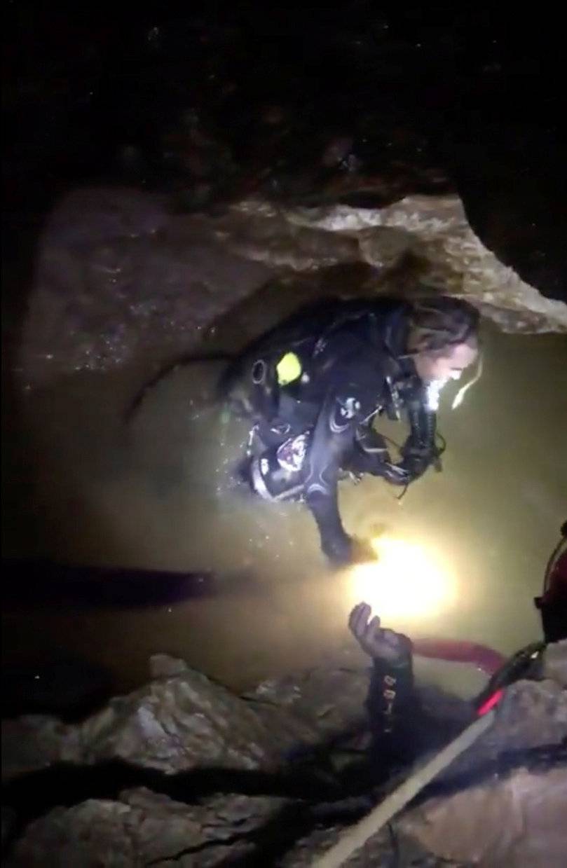 Ruamkatanyu Foundation rescuers are seen drillining ahead of the operation at the Tham Luang cave complex